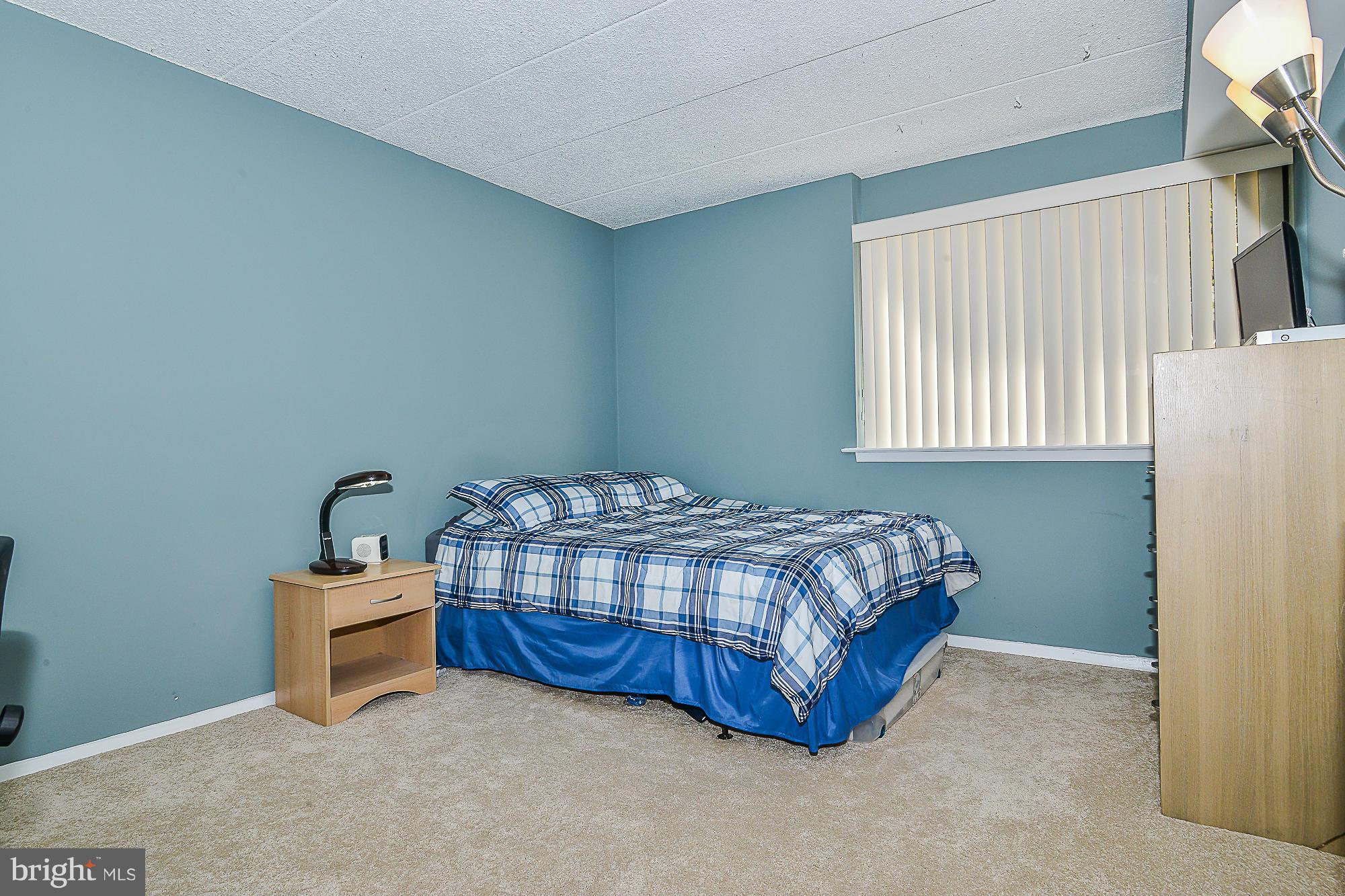 11620 Ivystone Court, Unit 101 Reston, VA 20191 - Photo 16 of 20 a bedroom with a bed and a window