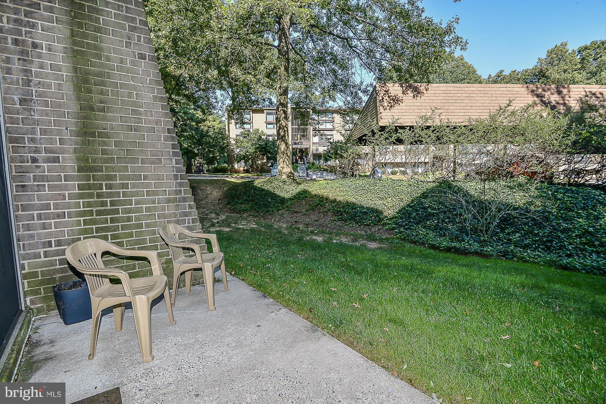 11620 Ivystone Court, Unit 101 Reston, VA 20191 - Photo 19 of 20 a view of backyard with outdoor seating