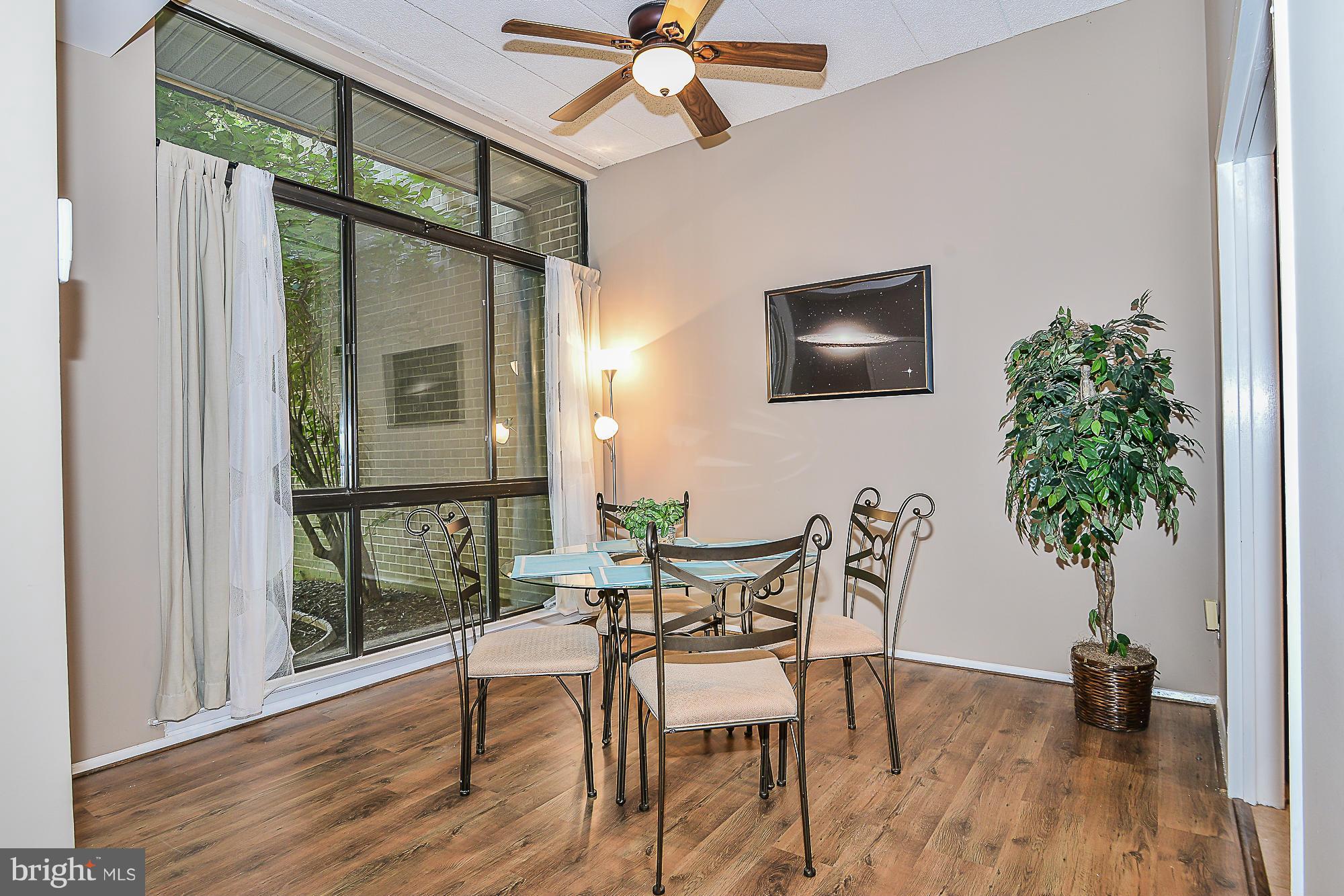 11620 Ivystone Court, Unit 101 Reston, VA 20191 - Photo 10 of 20 a dining room with furniture and window