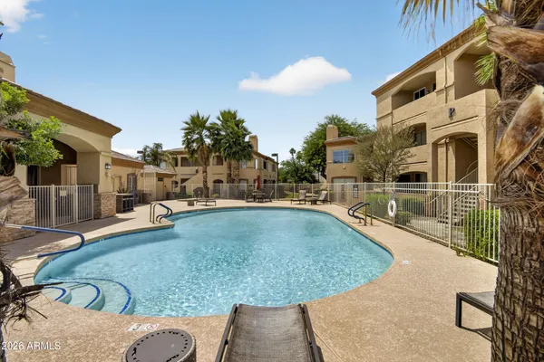 a view of a swimming pool with a patio