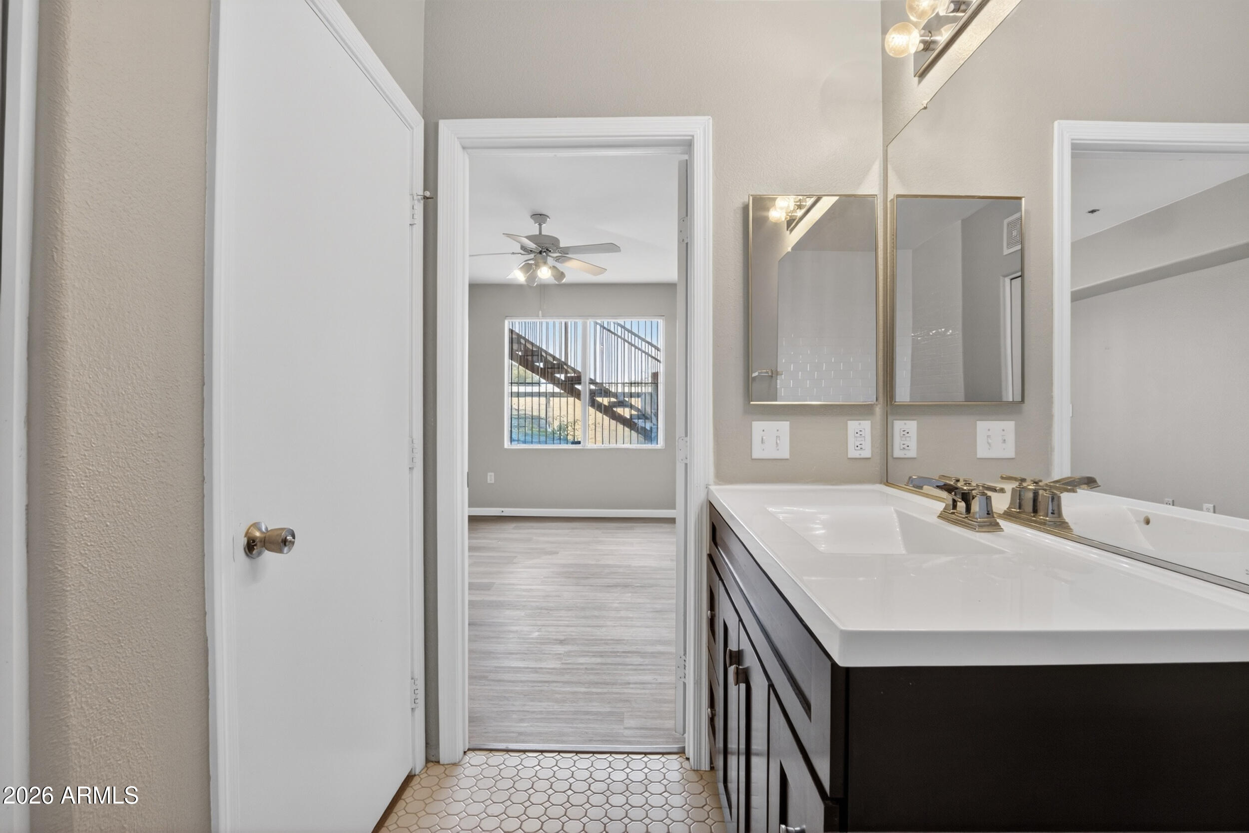 2134 East Broadway Road, Unit 1042 Tempe, AZ 85282 - Photo 20 of 33 a bathroom with a sink a mirror and a shower