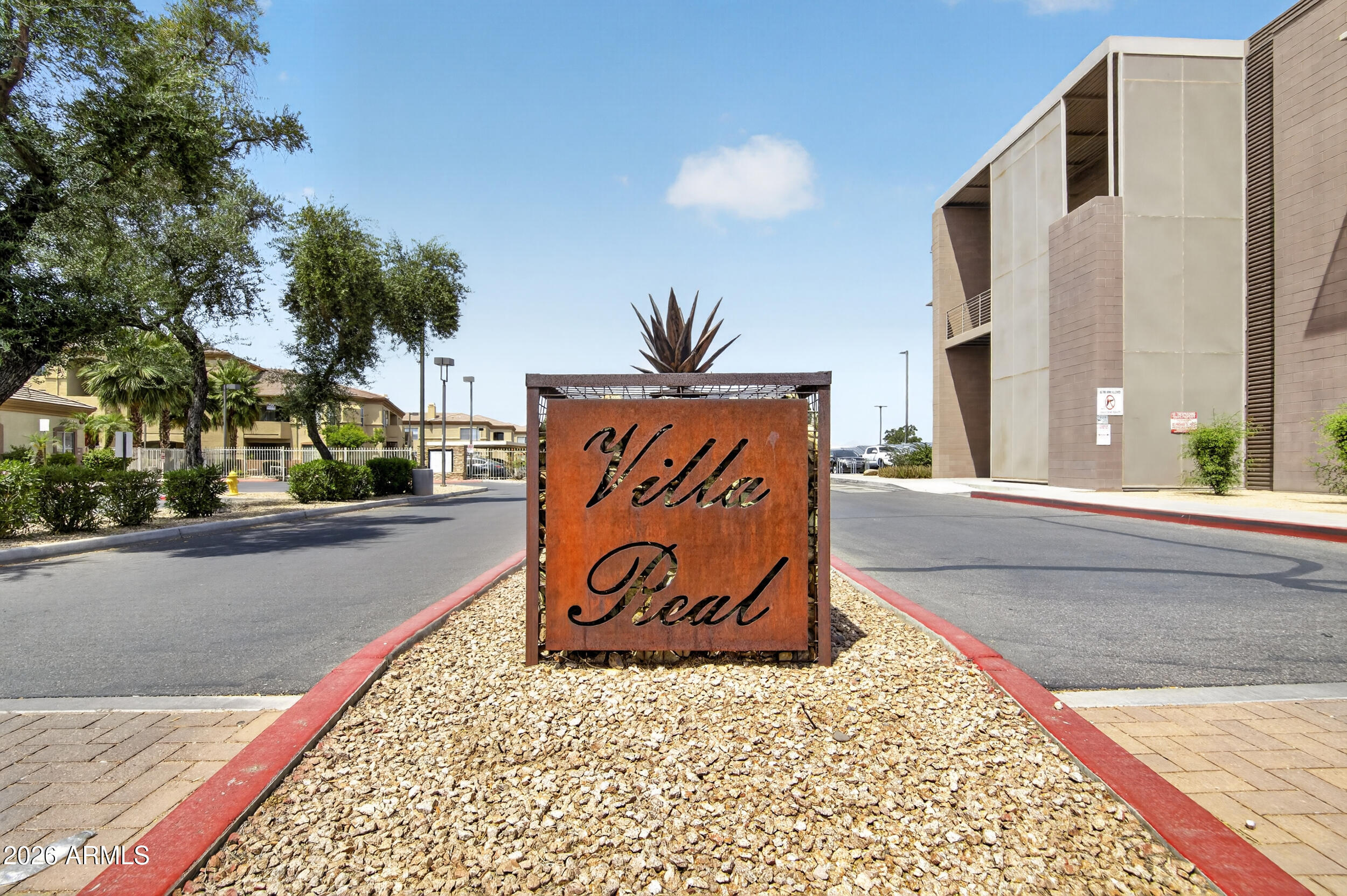 2134 East Broadway Road, Unit 1042 Tempe, AZ 85282 - Photo 2 of 33 a sign on the side of the road