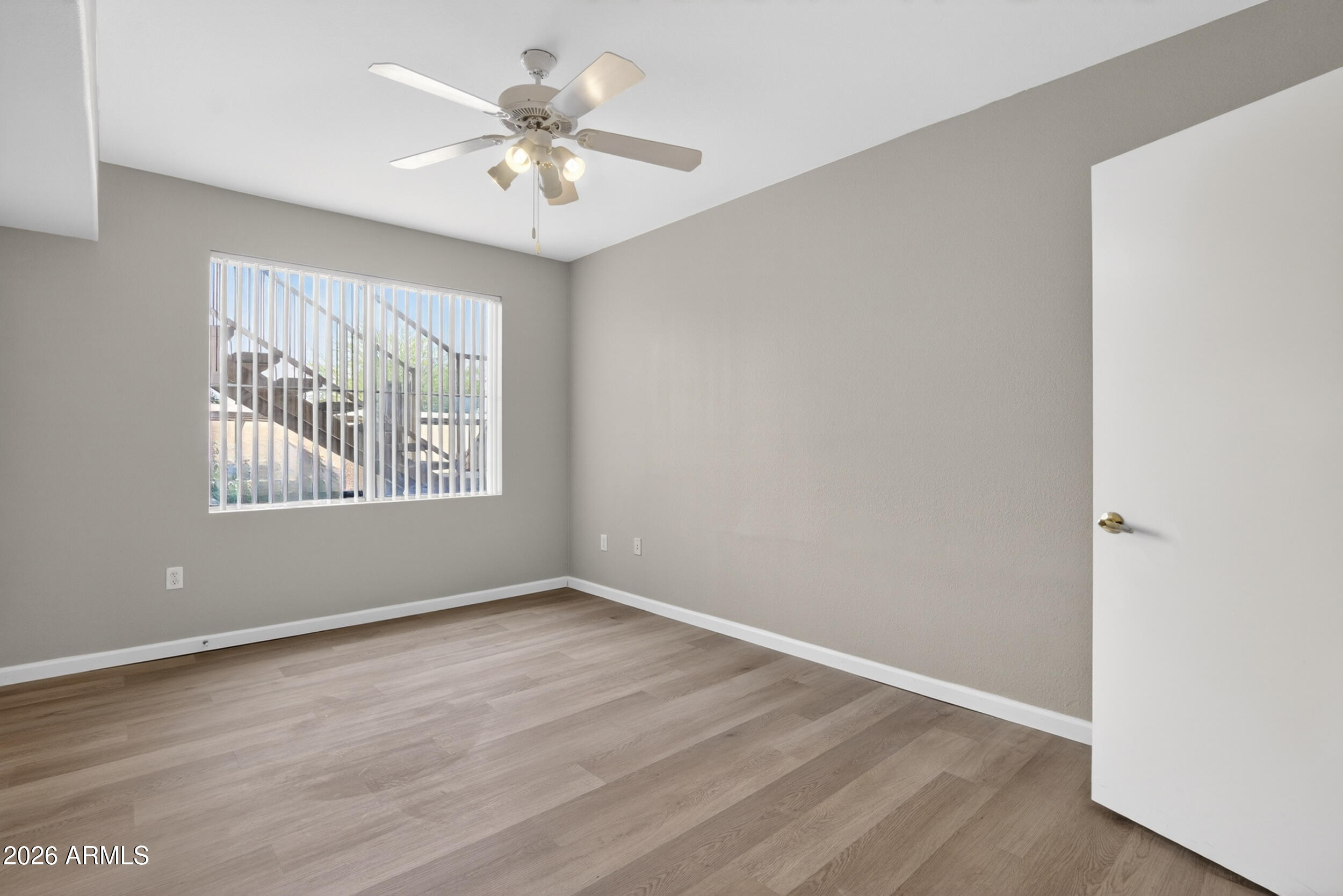 2134 East Broadway Road, Unit 1042 Tempe, AZ 85282 - Photo 24 of 33 wooden floor in an empty room with a window