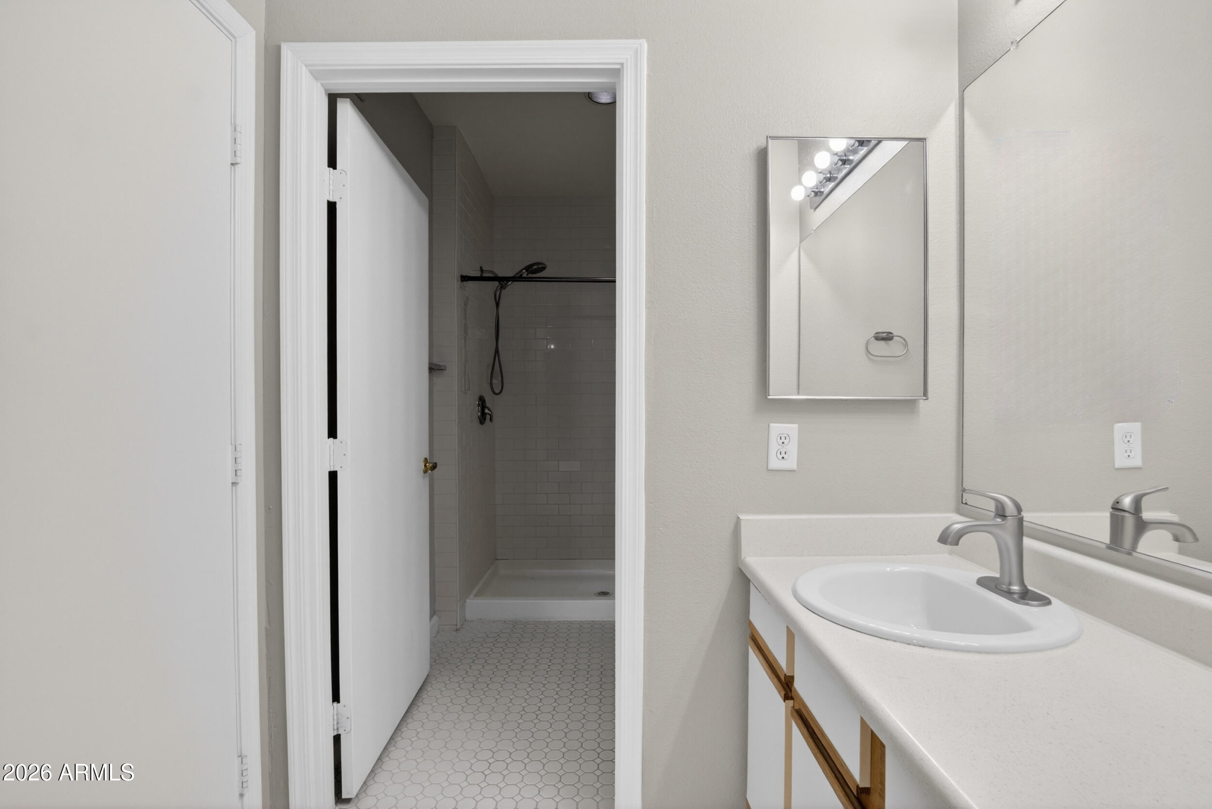 2134 East Broadway Road, Unit 1042 Tempe, AZ 85282 - Photo 28 of 33 a bathroom with a sink and a mirror