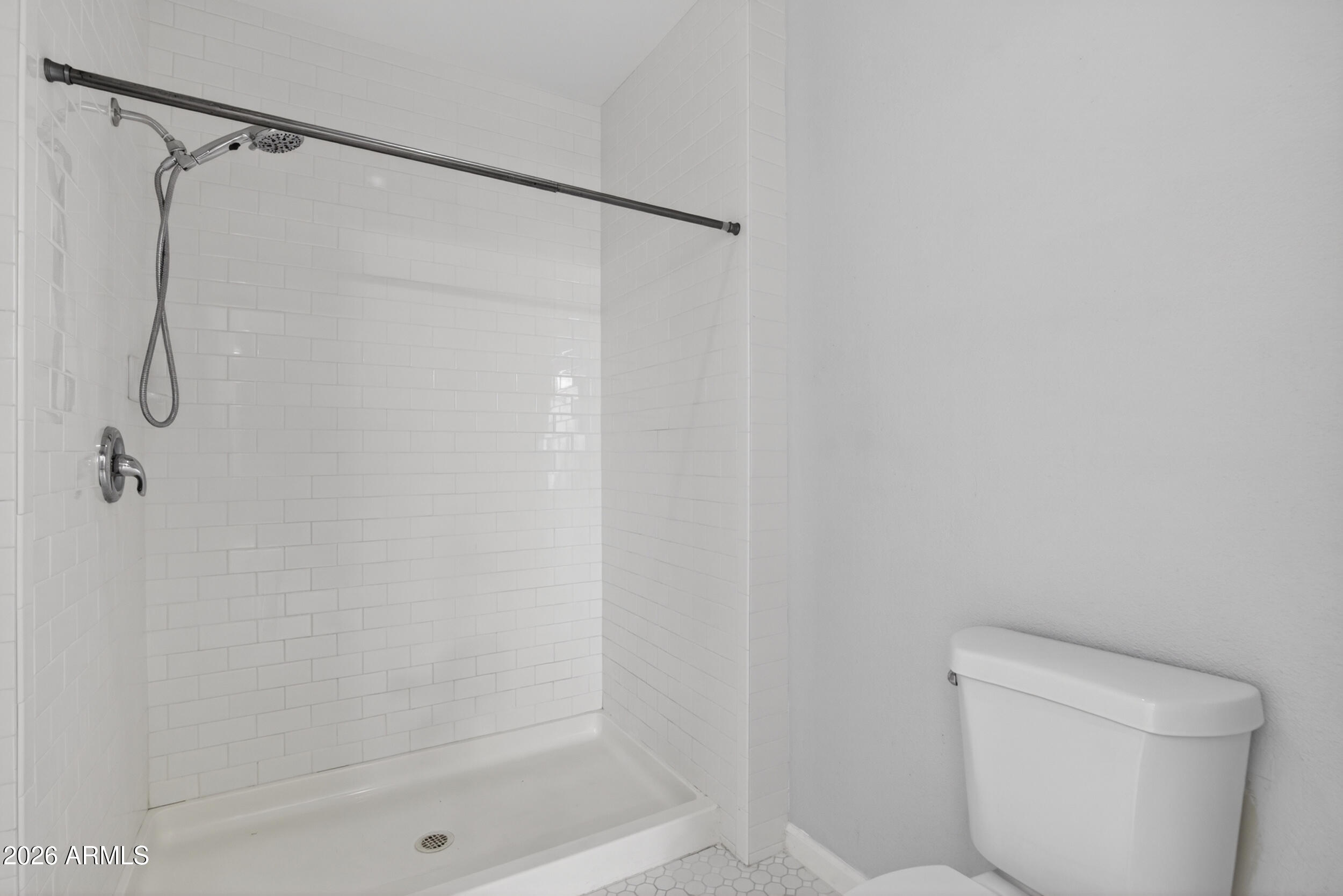 2134 East Broadway Road, Unit 1042 Tempe, AZ 85282 - Photo 29 of 33 a bathroom with a shower and a toilet