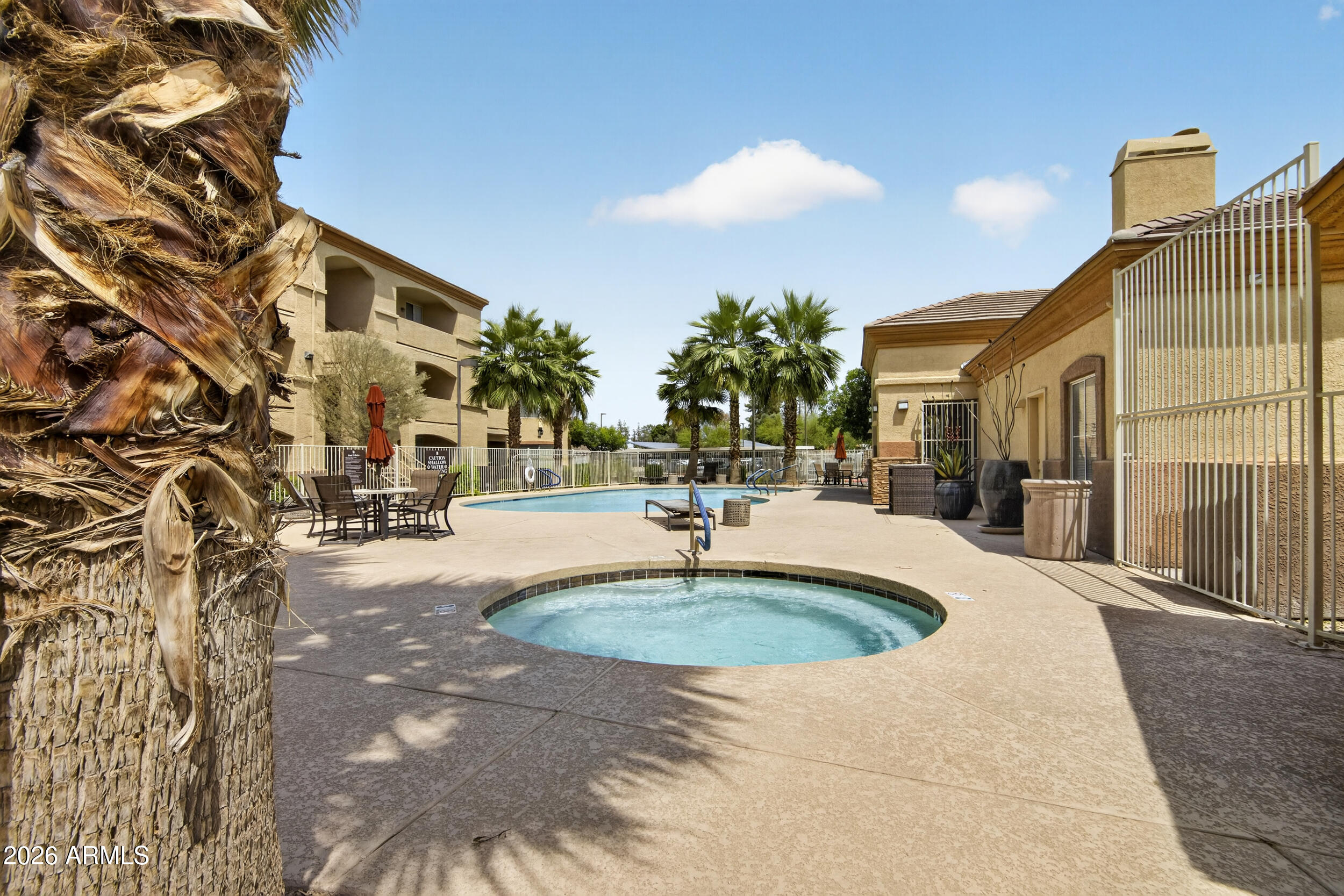 2134 East Broadway Road, Unit 1042 Tempe, AZ 85282 - Photo 33 of 33 a swimming pool with outdoor seating and yard