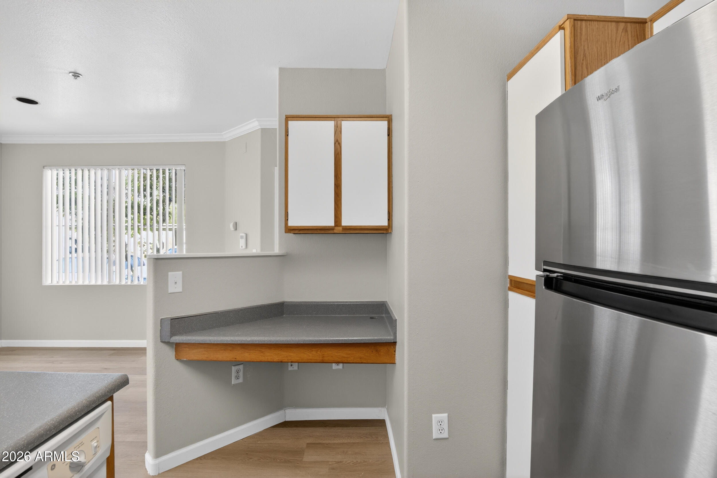 2134 East Broadway Road, Unit 1042 Tempe, AZ 85282 - Photo 8 of 33 a kitchen with stainless steel appliances granite countertop a refrigerator and a sink