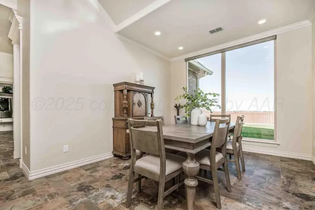 a large kitchen with stainless steel appliances lots of counter top space