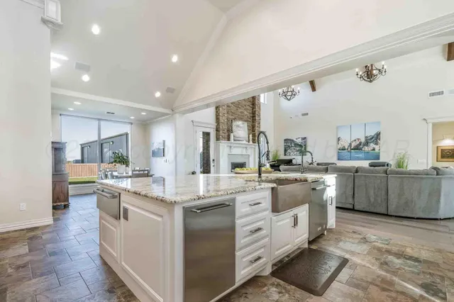 a spacious bathroom with a bathtub a sink and a mirror