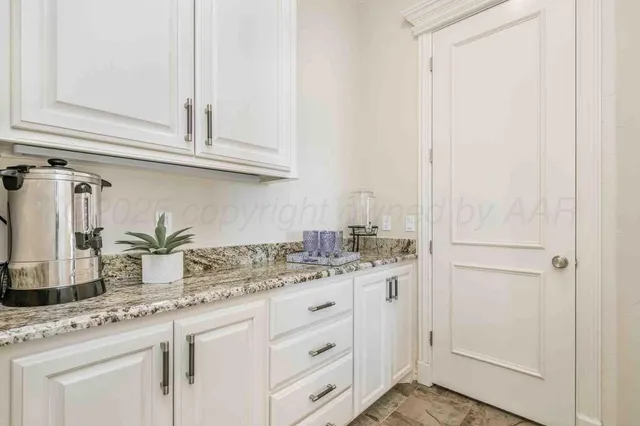 a spacious bedroom with a bed and a couch