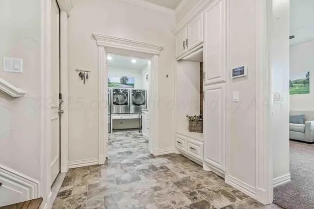 a bathroom with a granite countertop sink a toilet and a mirror