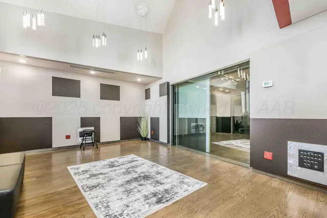 a open kitchen with white cabinets and stainless steel appliances