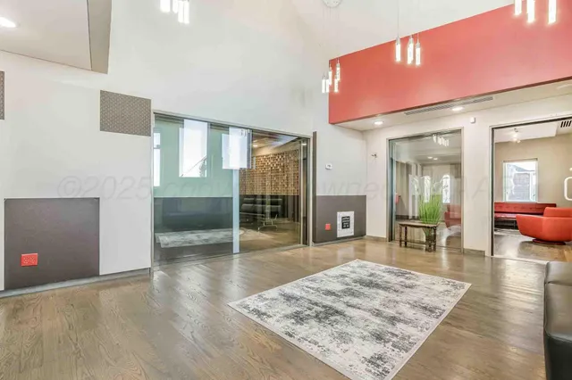 a kitchen with a sink a stove and a microwave