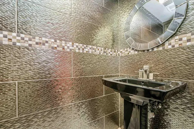 a bedroom with a bed and a television