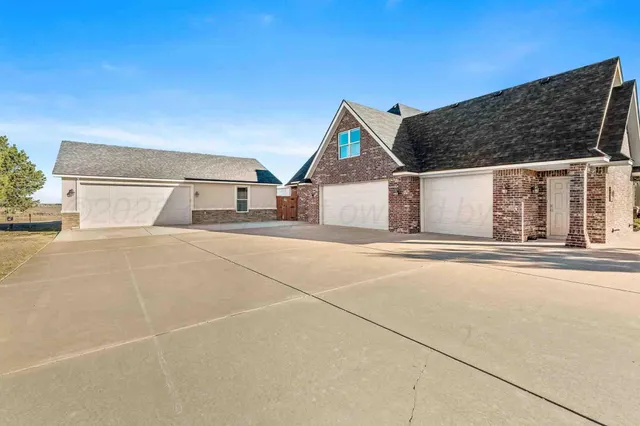 a view of a livingroom with furniture and a window