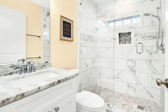 an aerial view of residential houses with outdoor space