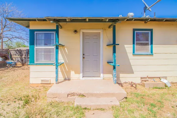 a large house with a large tree in front of it