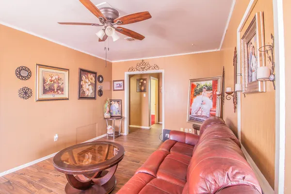 a living room with furniture and a table