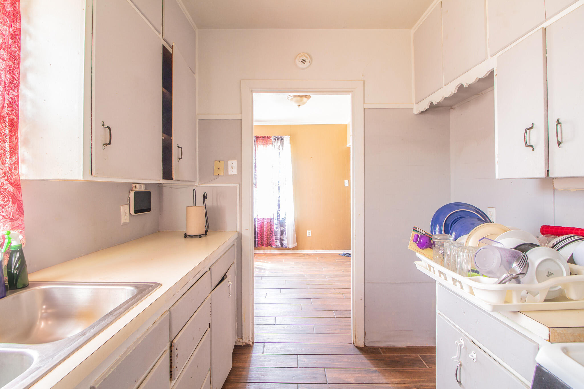 3215 Itasca Street Lubbock, TX 79415 - Photo 10 of 20 a kitchen with a sink cabinets and window