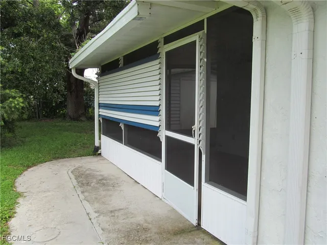 a side view of a house with a garage