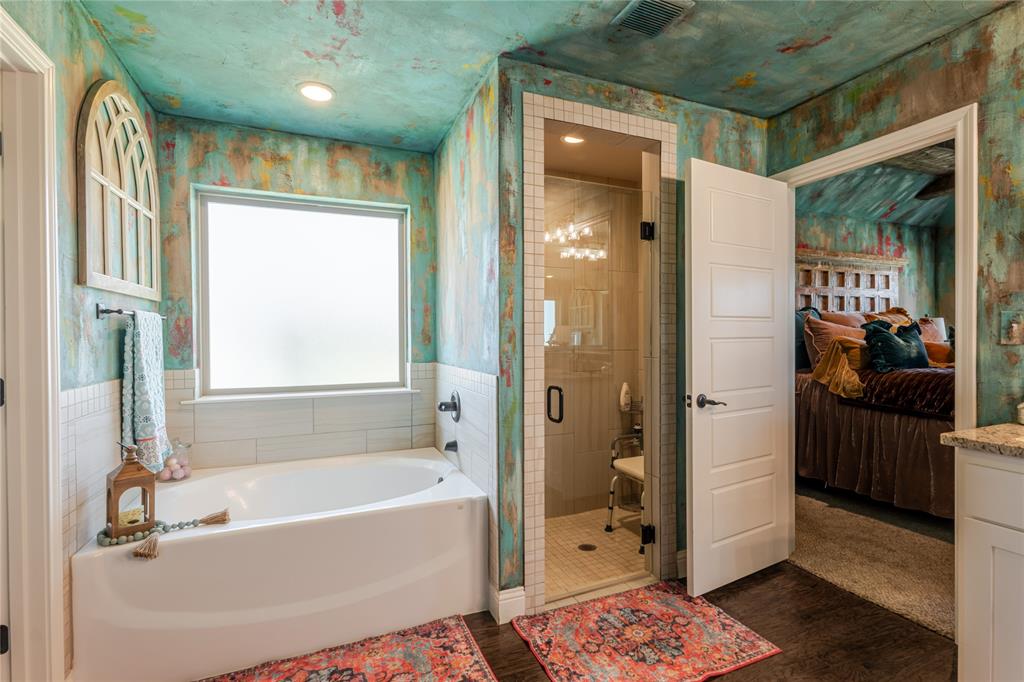 470 Wilson Bend Road Millsap, TX 76066 - Photo 19 of 39 a bathroom with a bathtub and a shower