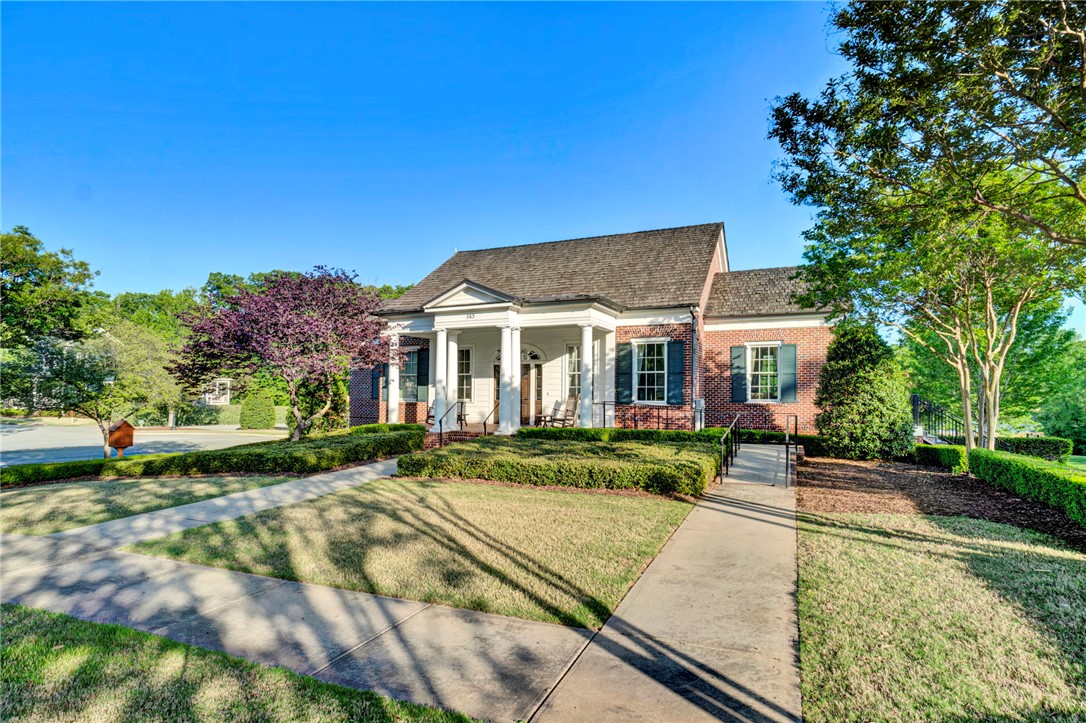 118 Tuttle Street Clemson, SC 29631 - Photo 7 of 9 A classic brick exterior with white columns and manicured landscaping creates inviting curb appeal.