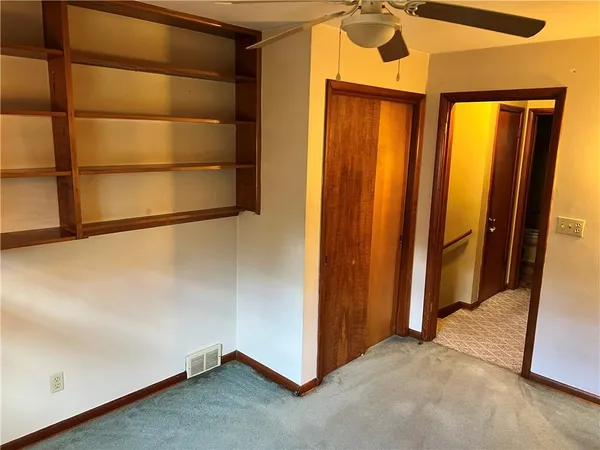 an empty room with wooden floor