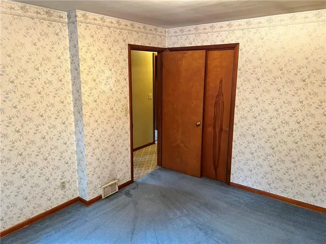 a bathroom with a sink mirror vanity and toilet