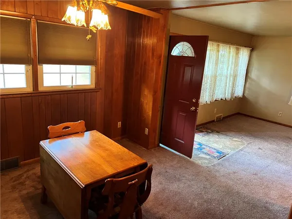 a bathroom with a granite countertop shower and a toilet