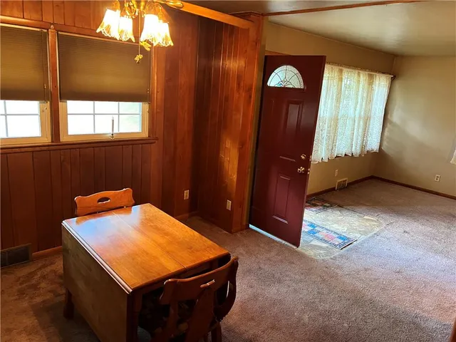 a bathroom with a granite countertop shower and a toilet