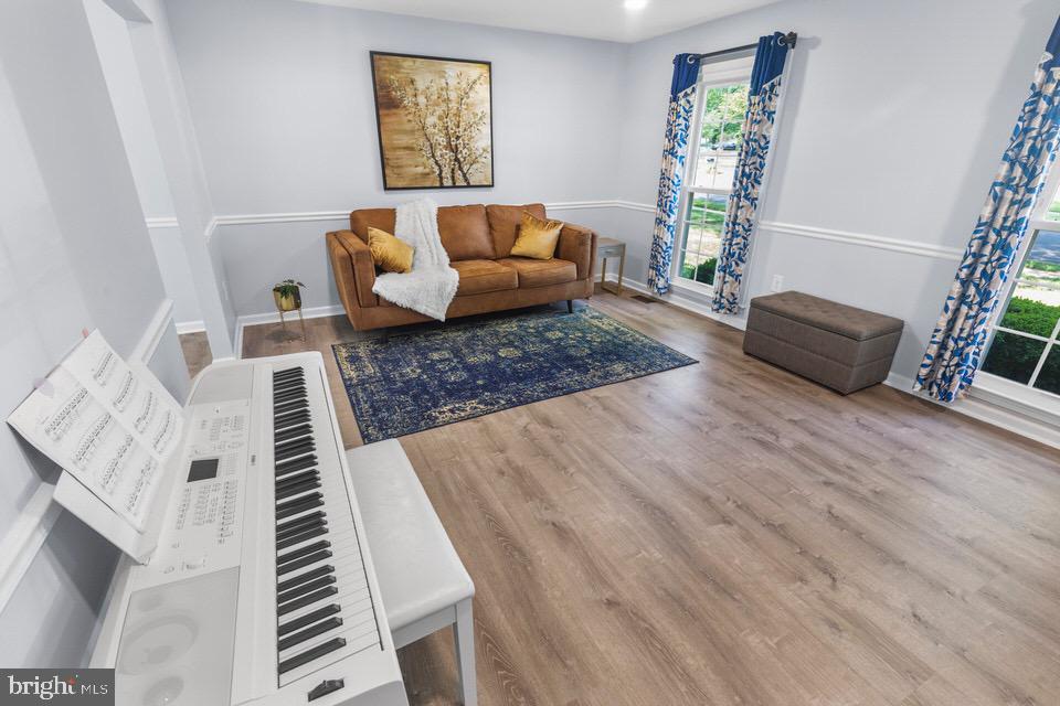 13338 Point Rider Lane Herndon, VA 20171 - Photo 13 of 36 a living room with furniture and a wooden floor