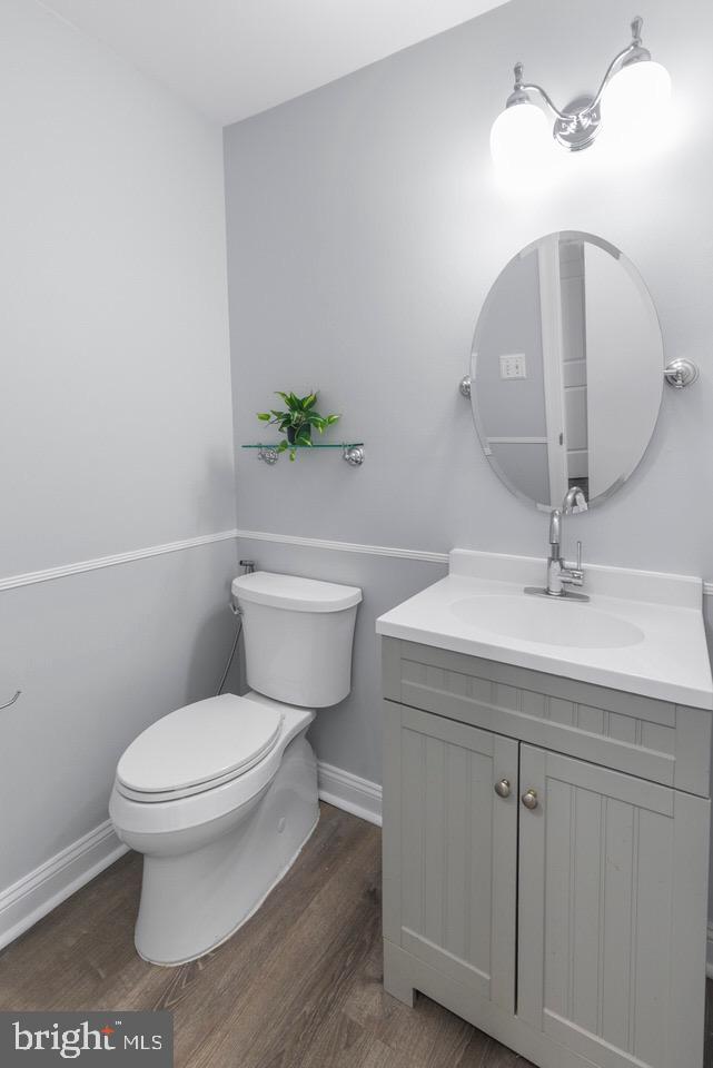 13338 Point Rider Lane Herndon, VA 20171 - Photo 17 of 36 a bathroom with a sink a toilet and a mirror