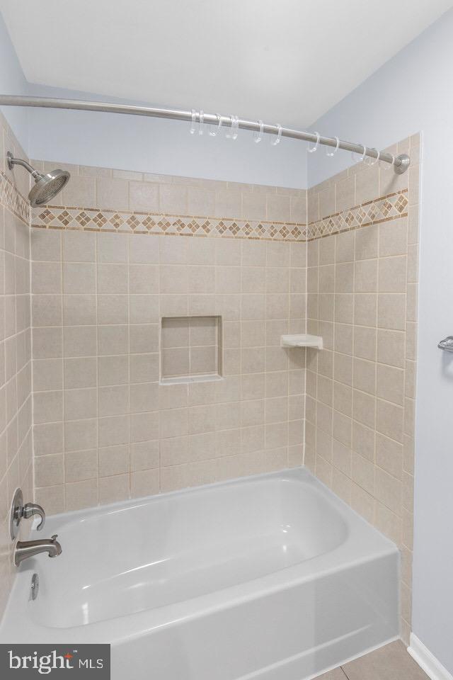 13338 Point Rider Lane Herndon, VA 20171 - Photo 22 of 36 a bathroom with a shower and a bath tub