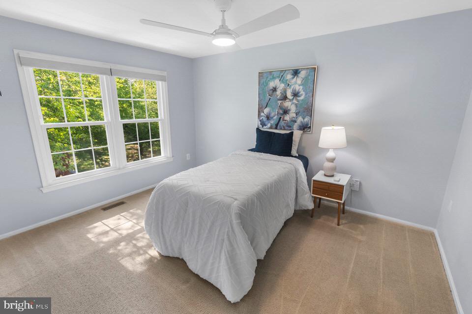 13338 Point Rider Lane Herndon, VA 20171 - Photo 25 of 36 a bedroom with a bed and a window