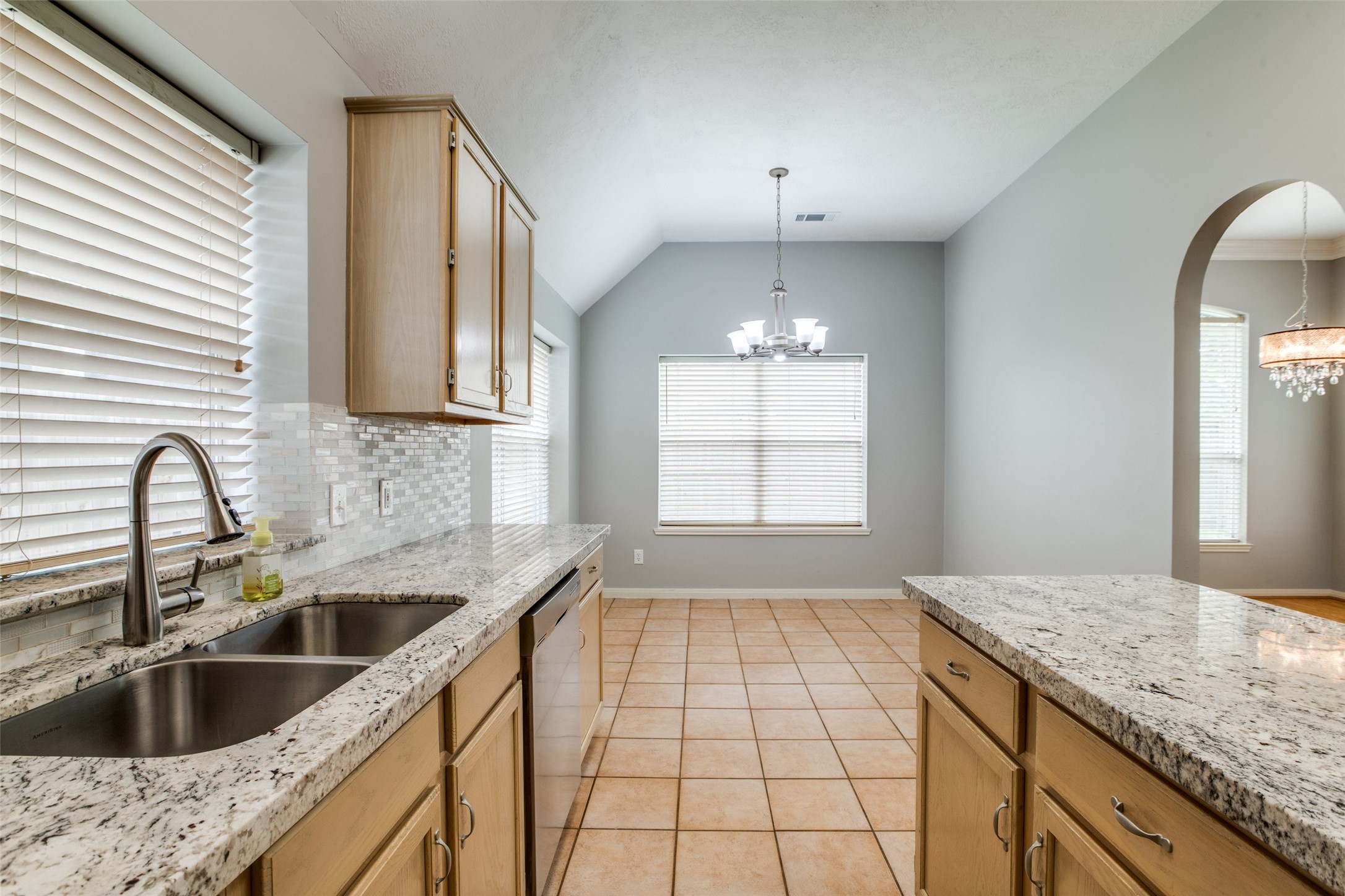 9331 Rodgers Road Houston, TX 77070 - Photo 17 of 25 a kitchen with a sink cabinets a window and appliances