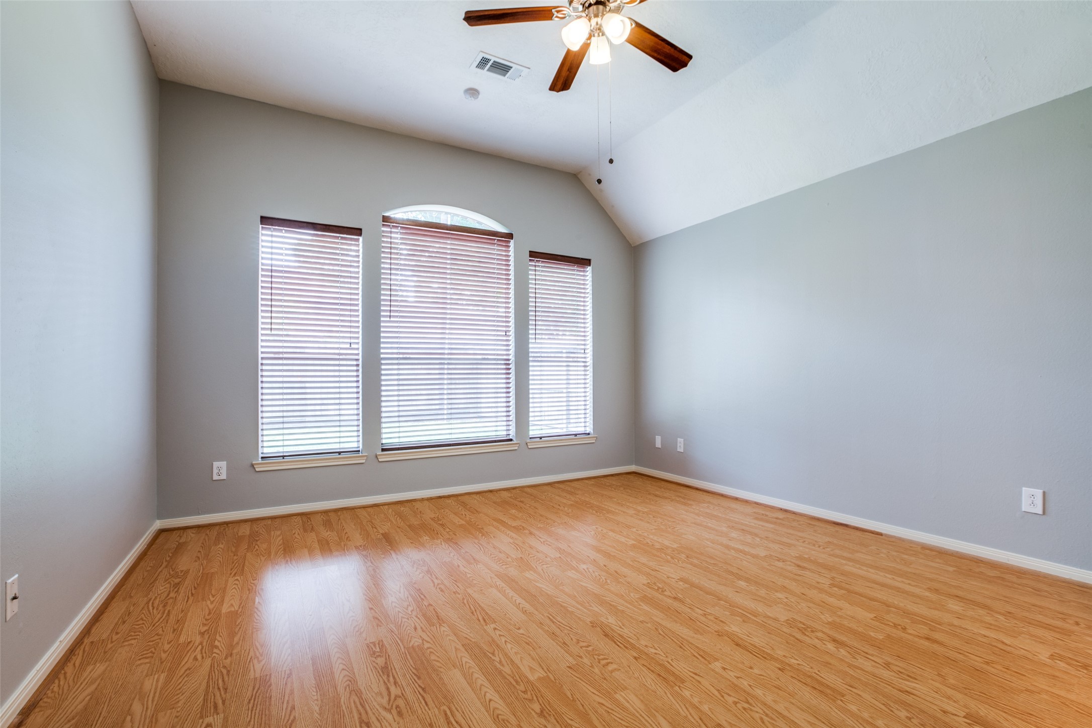 9331 Rodgers Road Houston, TX 77070 - Photo 19 of 25 wooden floor in an empty room with a window