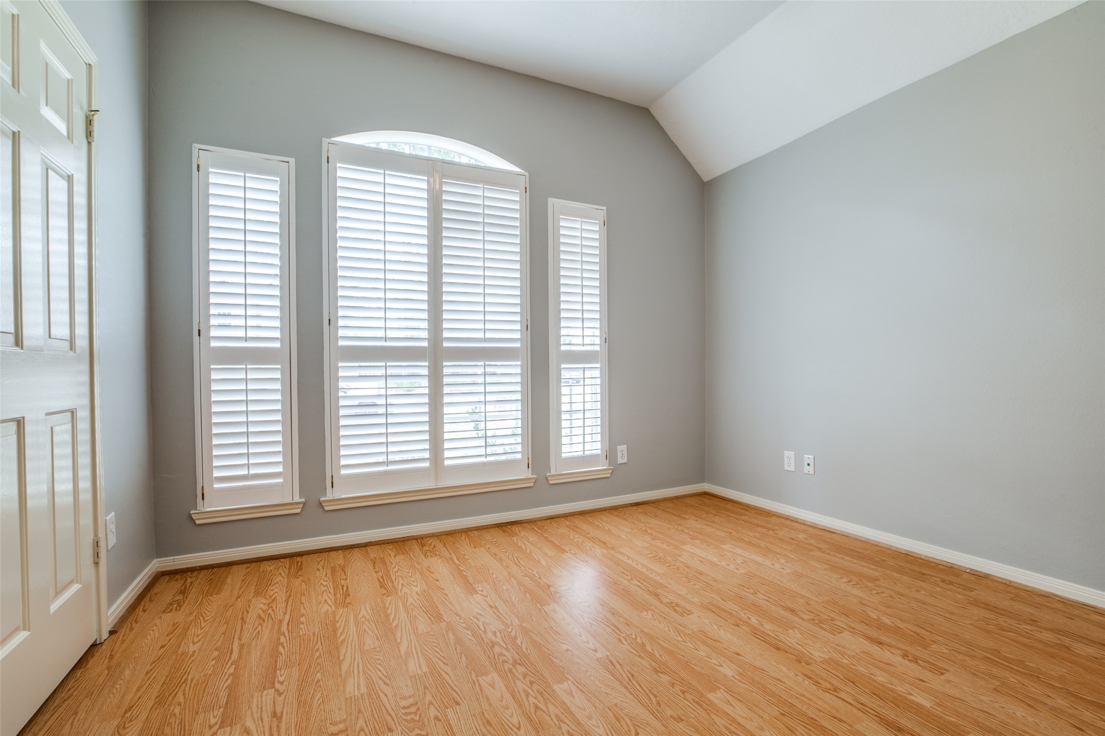 9331 Rodgers Road Houston, TX 77070 - Photo 21 of 25 an empty room with wooden floor and windows