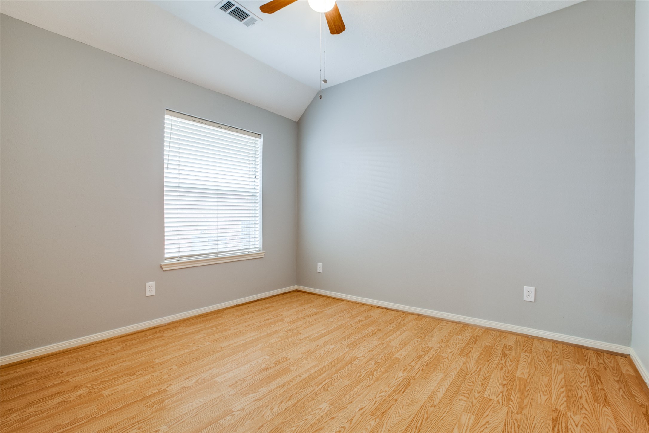 9331 Rodgers Road Houston, TX 77070 - Photo 23 of 25 wooden floor in an empty room with a window