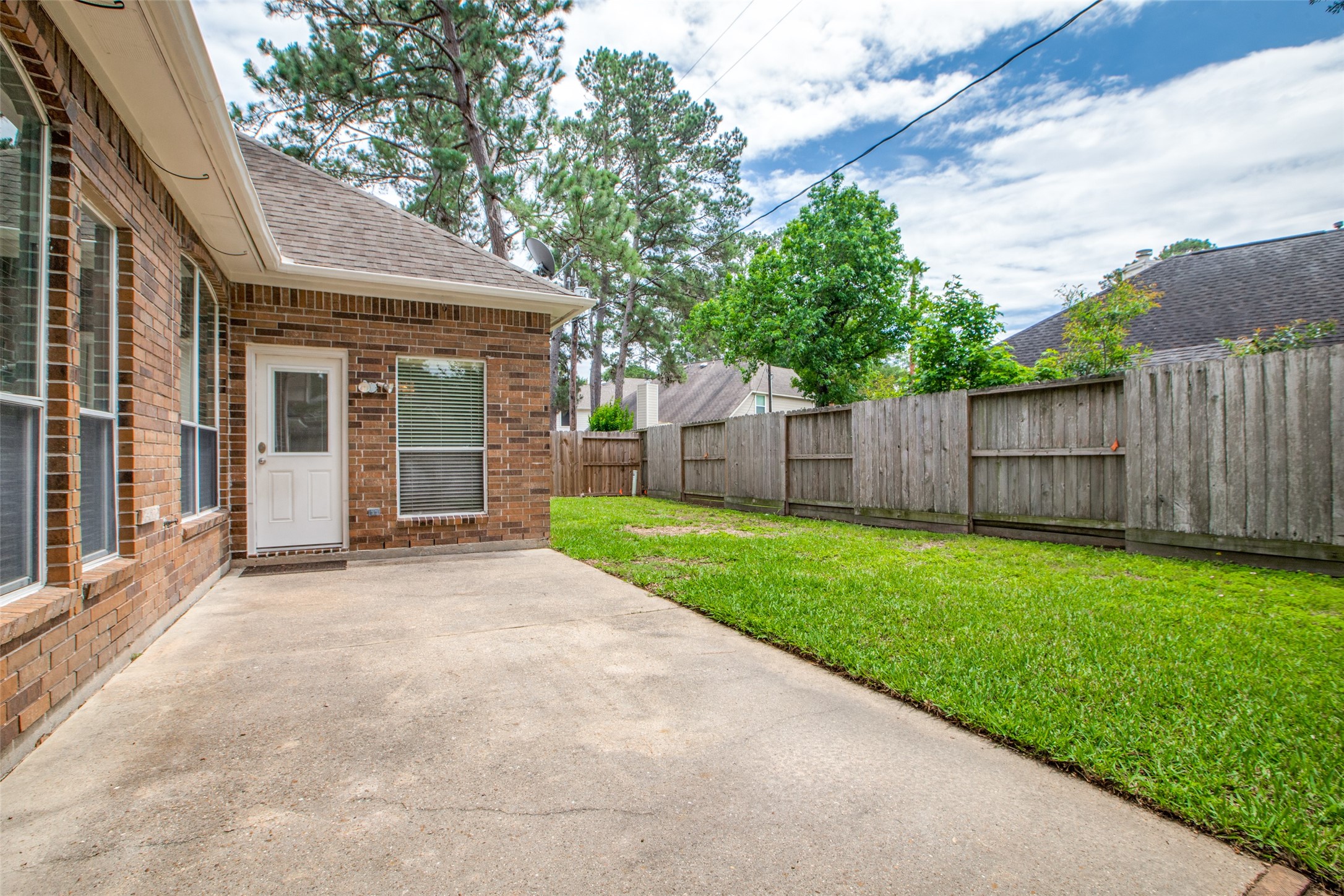 9331 Rodgers Road Houston, TX 77070 - Photo 24 of 25 a view of a house with yard and a garden