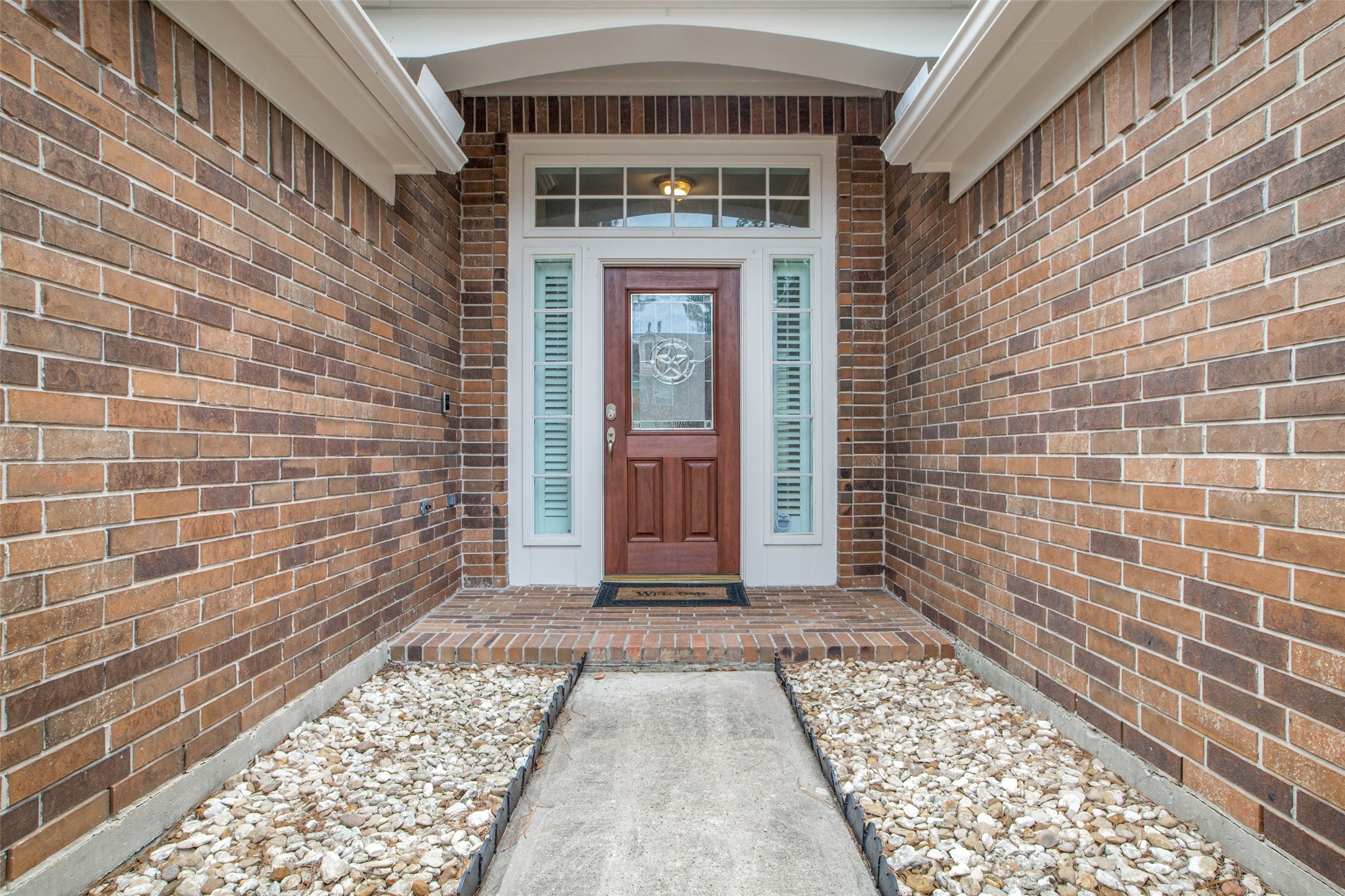 9331 Rodgers Road Houston, TX 77070 - Photo 3 of 25 a view of a brick house with a large window
