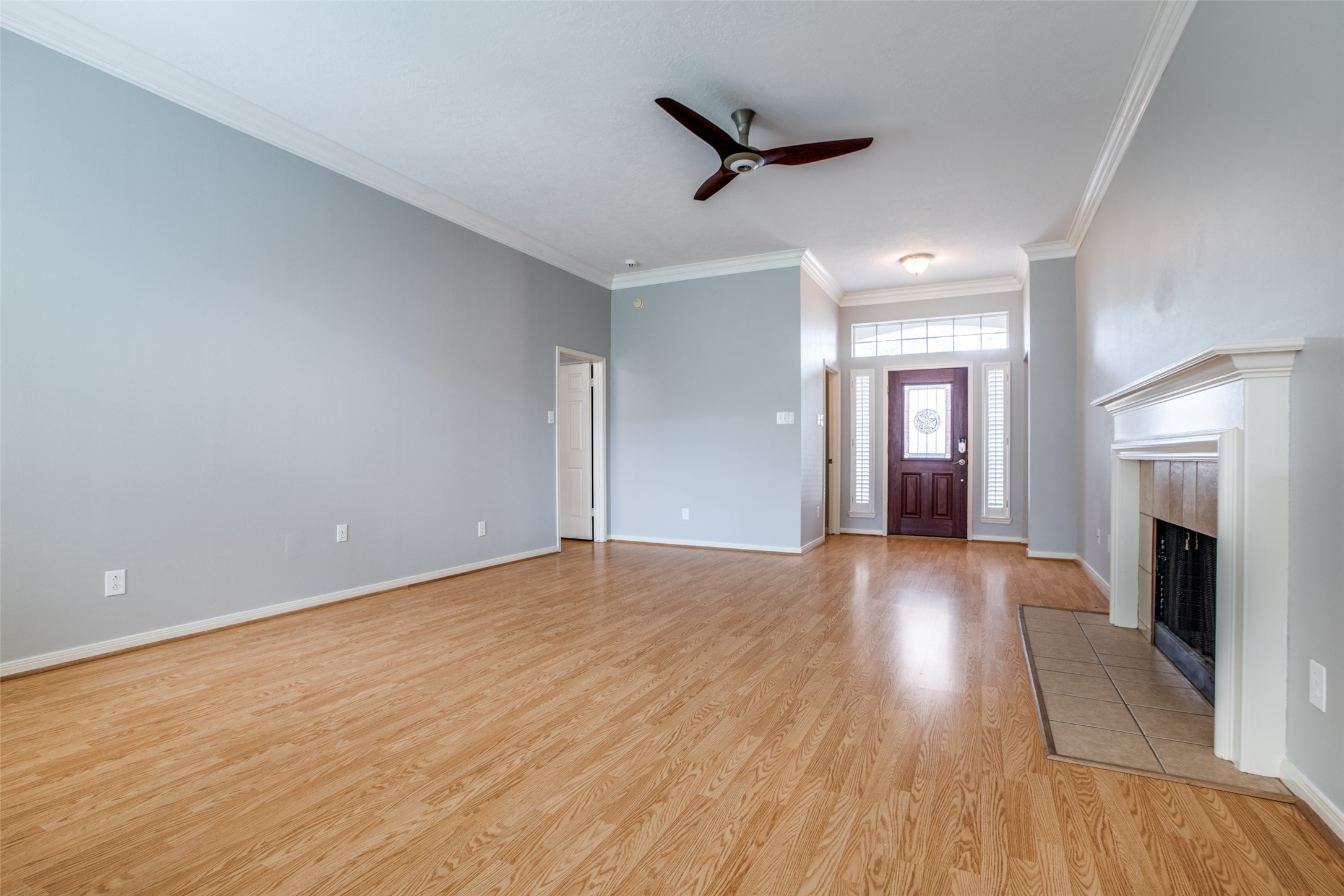 9331 Rodgers Road Houston, TX 77070 - Photo 5 of 25 a view of empty room with wooden floor and fireplace