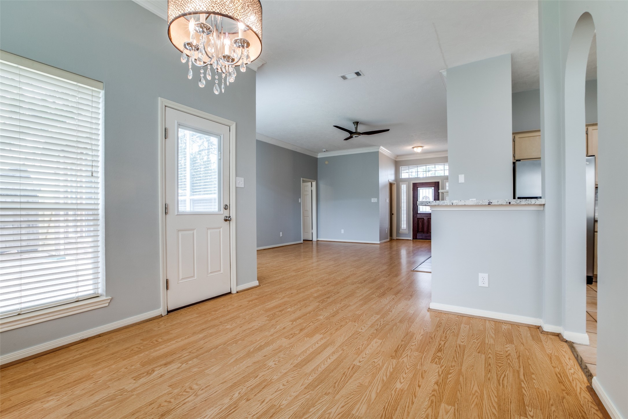 9331 Rodgers Road Houston, TX 77070 - Photo 6 of 25 an empty room with wooden floor and windows