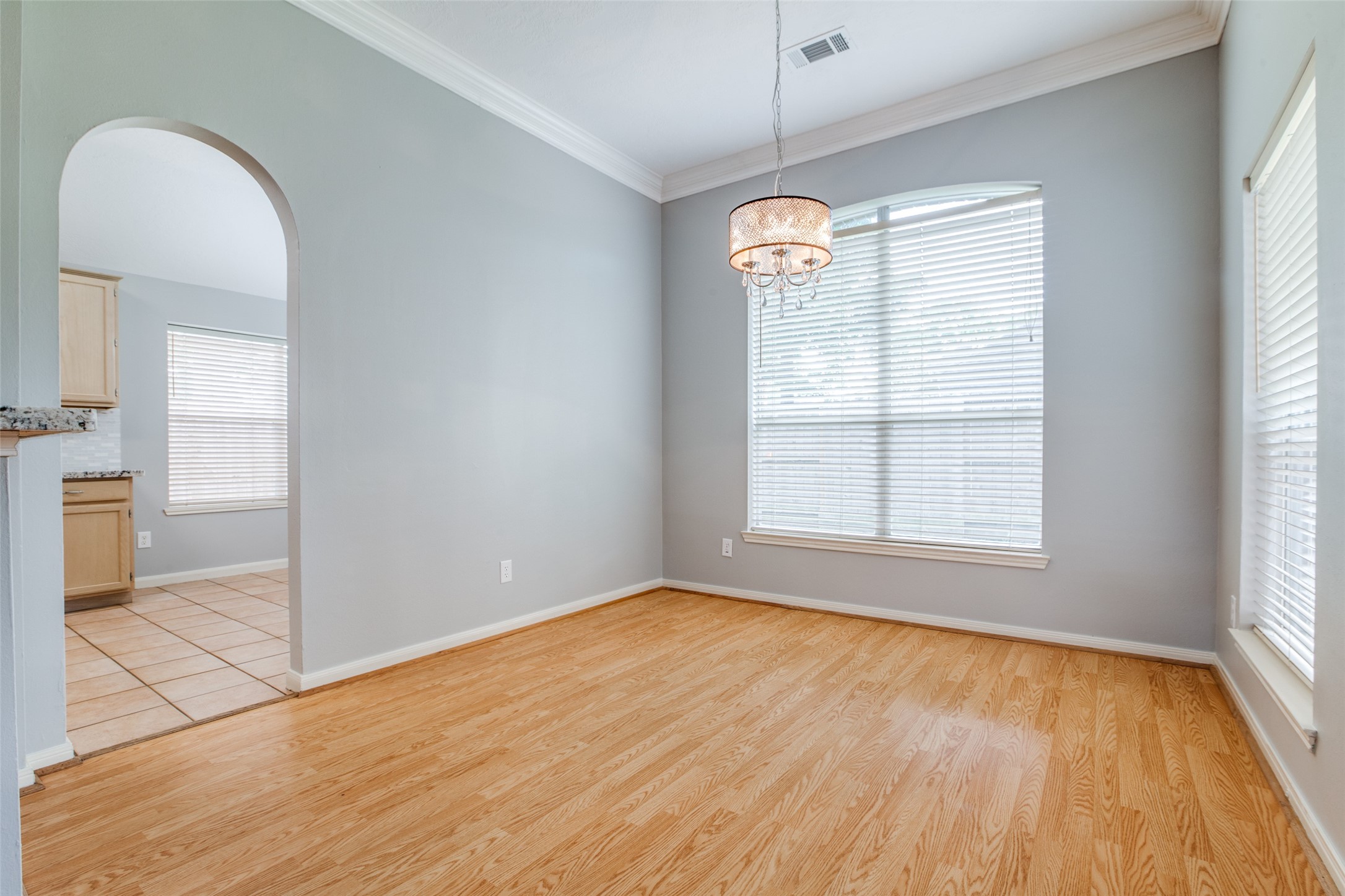 9331 Rodgers Road Houston, TX 77070 - Photo 10 of 25 wooden floor in an empty room with a window