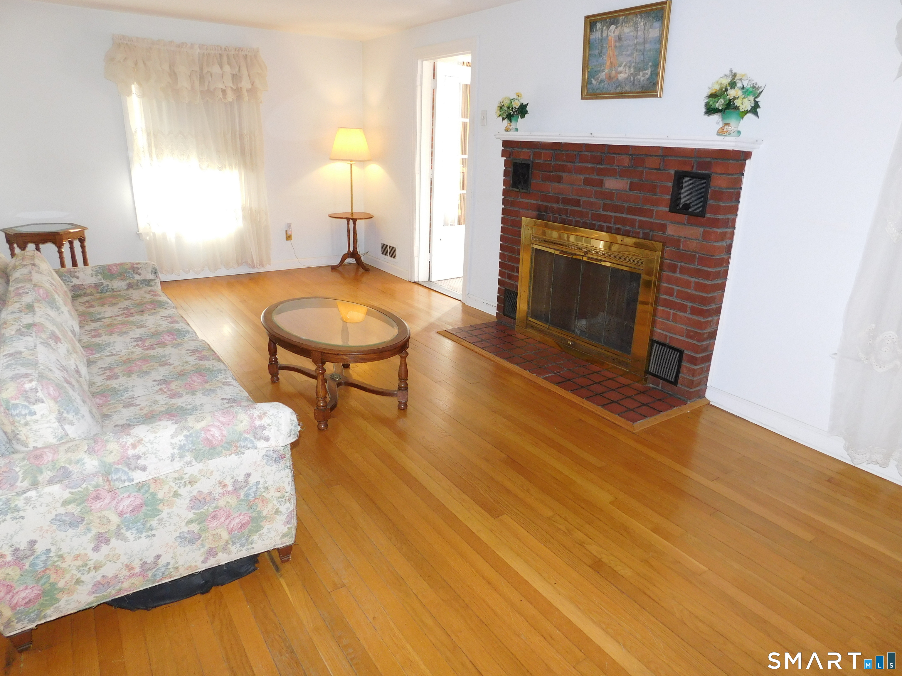 60 E Street Derby, CT 06418 - Photo 14 of 30 a living room with a fireplace furniture and a fireplace