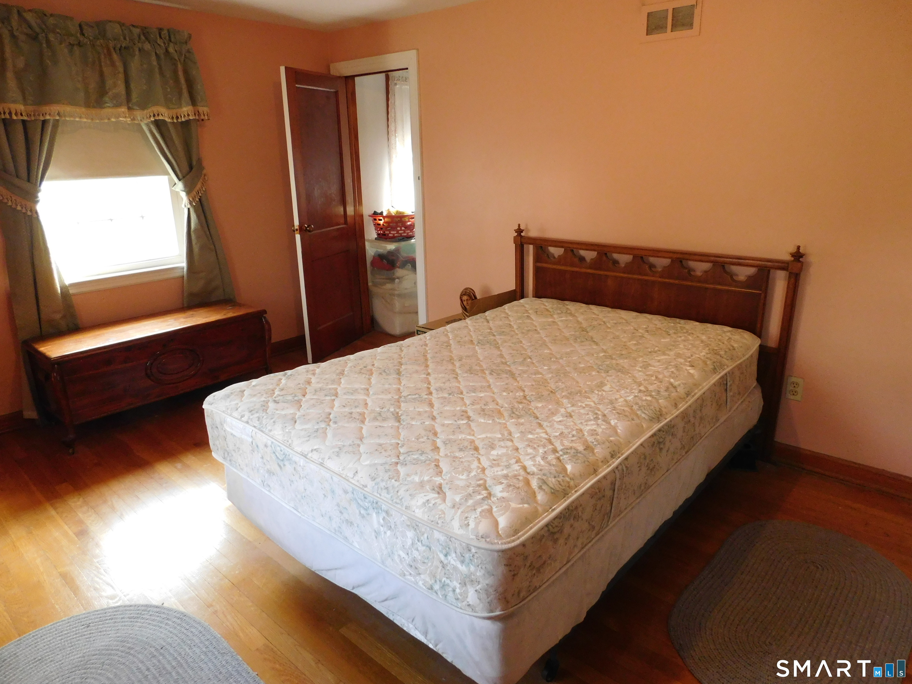 60 E Street Derby, CT 06418 - Photo 20 of 31 a bed sitting in a bedroom next to a window