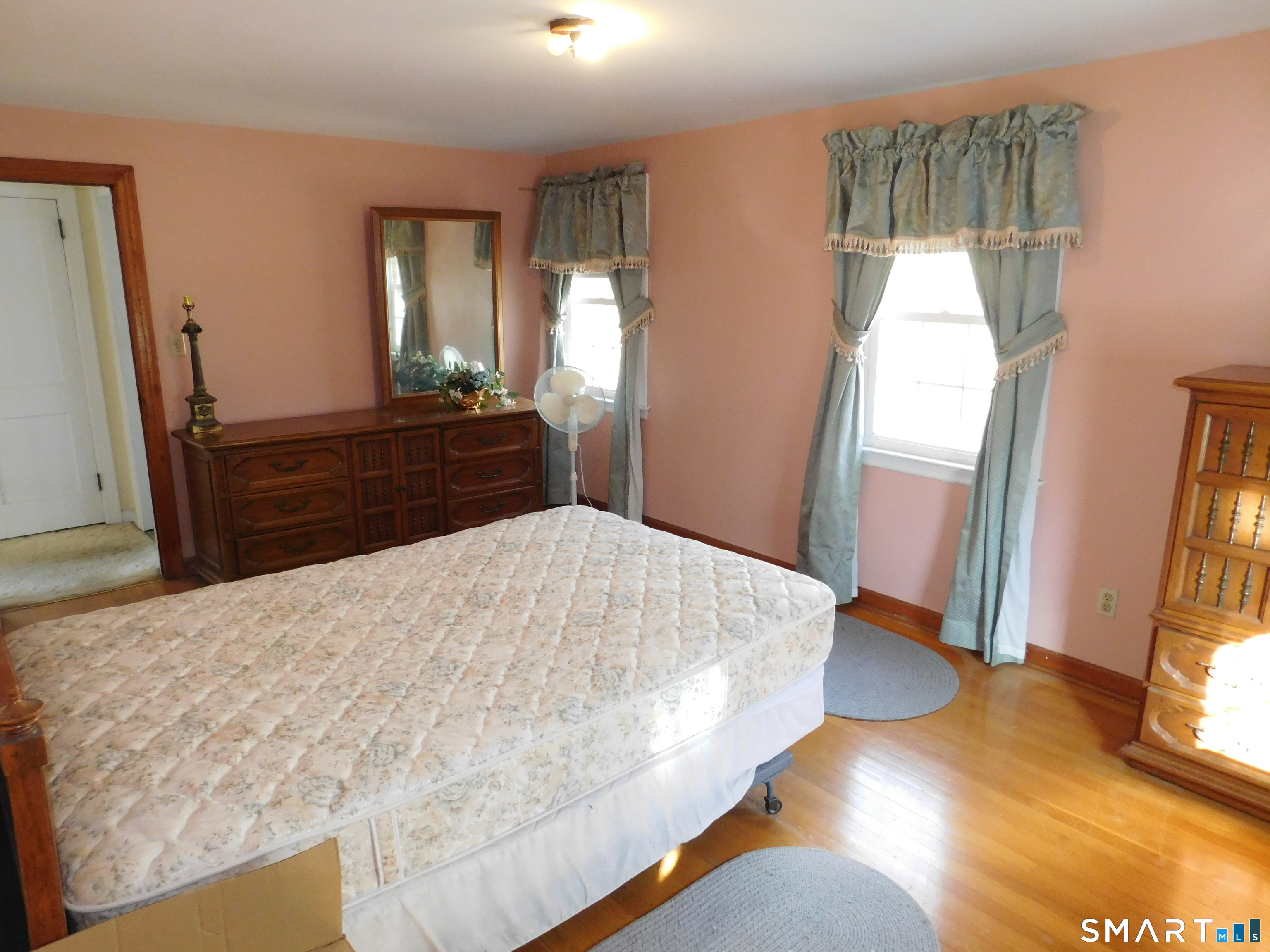 60 E Street Derby, CT 06418 - Photo 24 of 30 a bedroom with a bed and a mirror on dresser