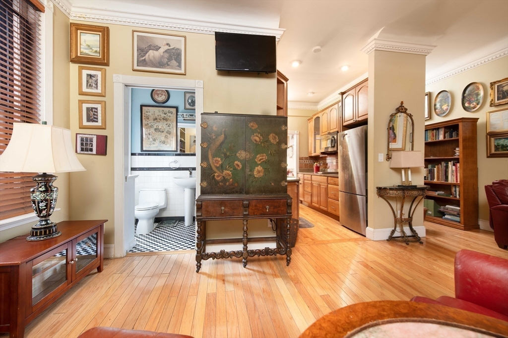 362 Commonwealth Avenue, Unit 2E 2F Boston, MA 02115 - Photo 5 of 17 a living room with furniture and a wooden floor