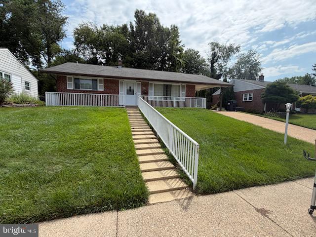 11 Homewood Road Wilmington, DE 19803 - Photo 1 of 47 a front view of a house with a garden
