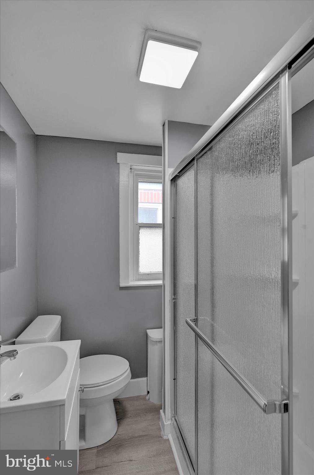 1409 Church Street Reading, PA 19601 - Photo 15 of 23 a white toilet sitting next to a bathroom sink