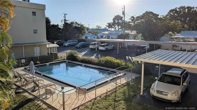 a view of a patio in a backyard